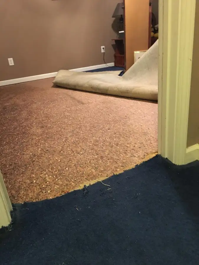 Carpet pad removal revealing water damage during Drying & Dehumidification in Slaton