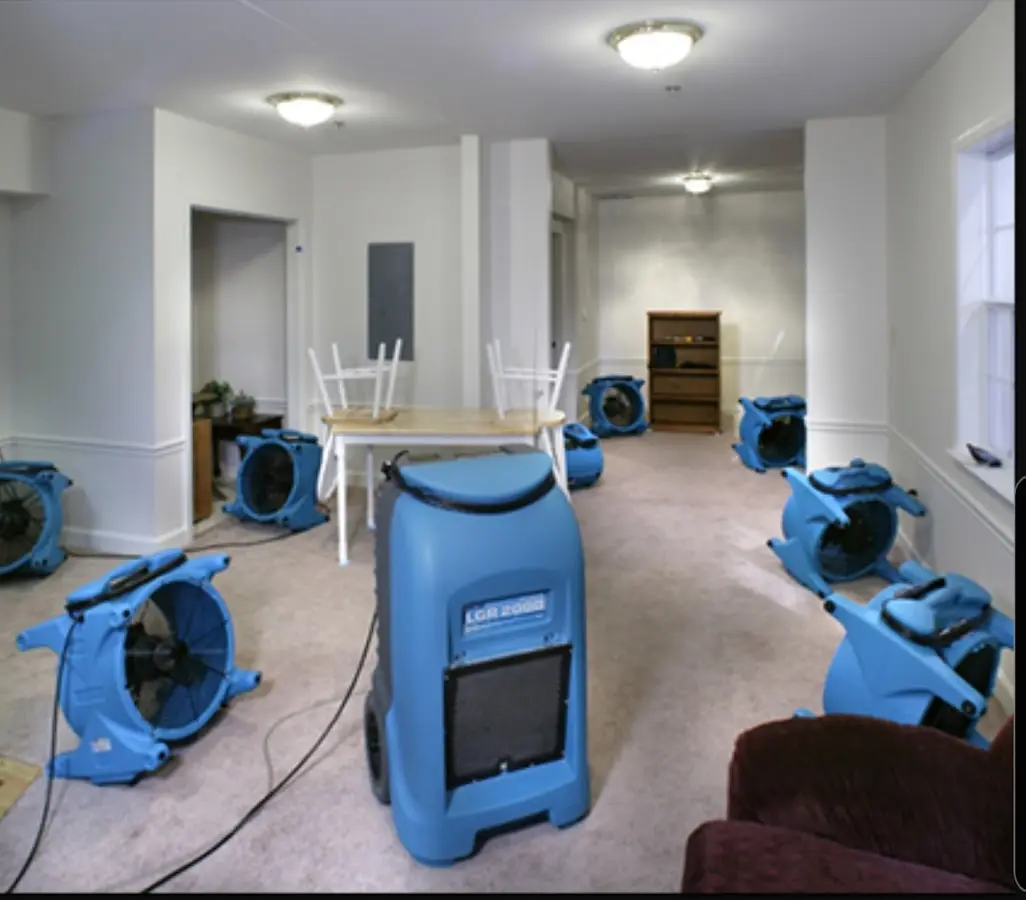 Air movers and dehumidifier setup for Water Damage Restoration in Slaton